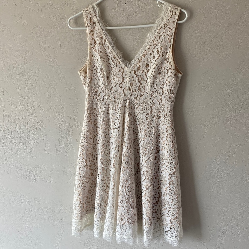 White lace dress with nude underneath